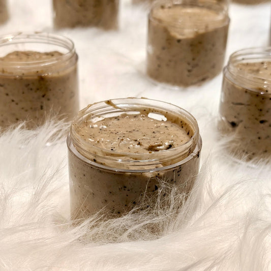 Coffee Face Scrub in a jar with ground coffee texture