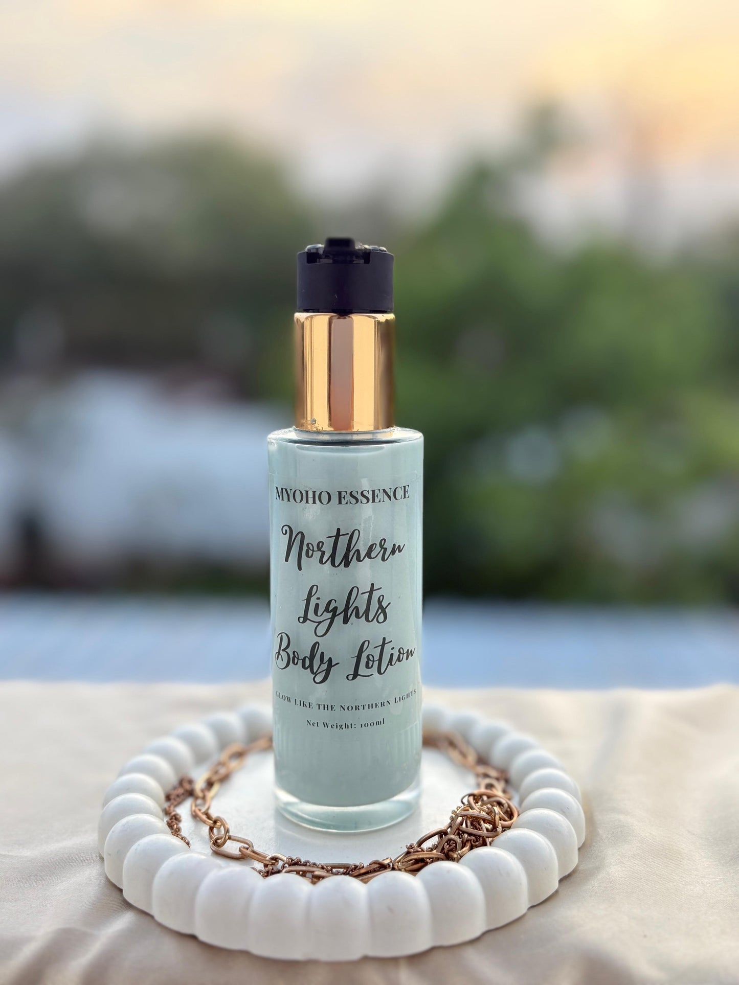 Bottle of Northern Lights Body Lotion with shimmering label.